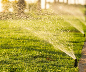 sprinkler system watering lawn